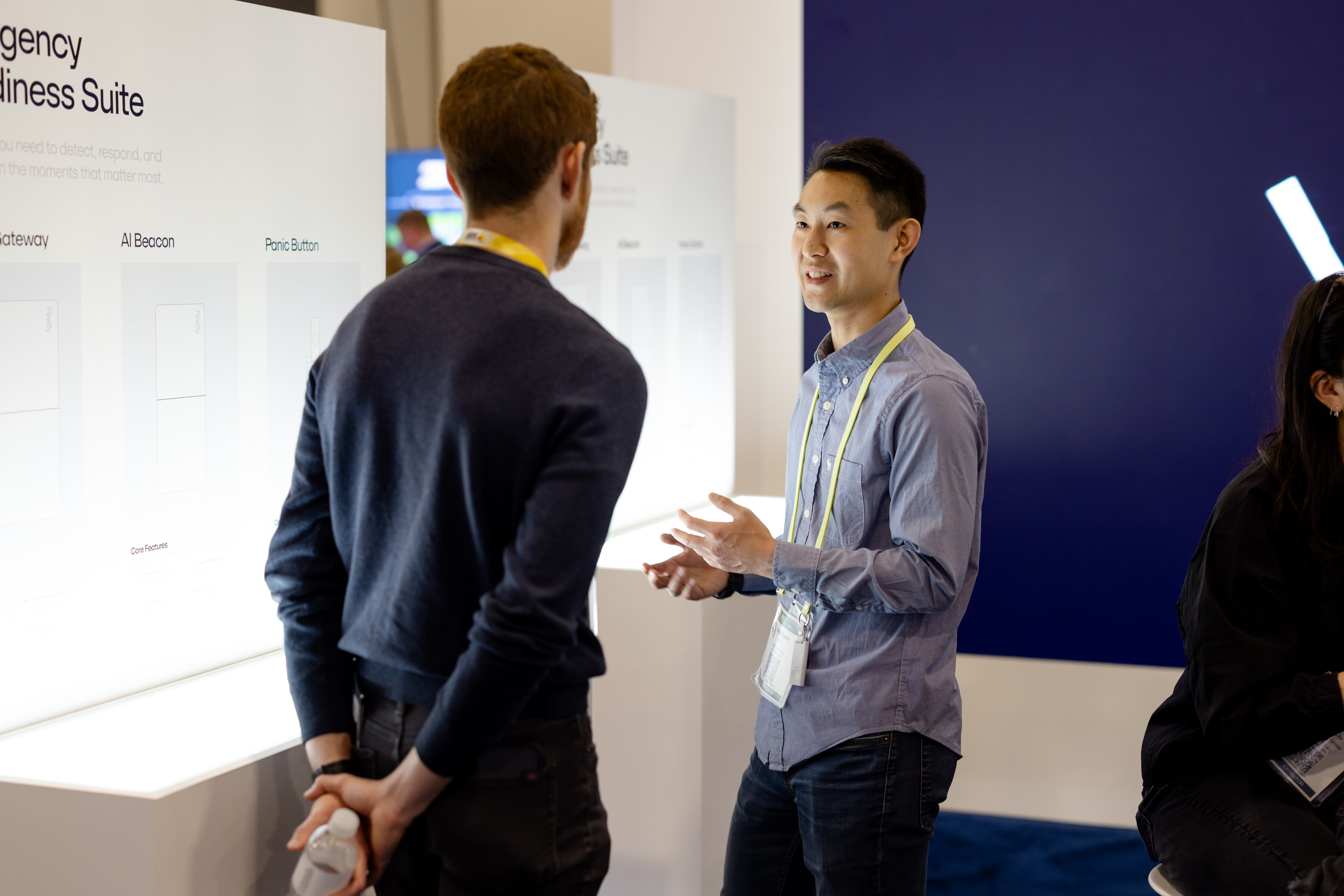 Two professionals in conversation during a demo